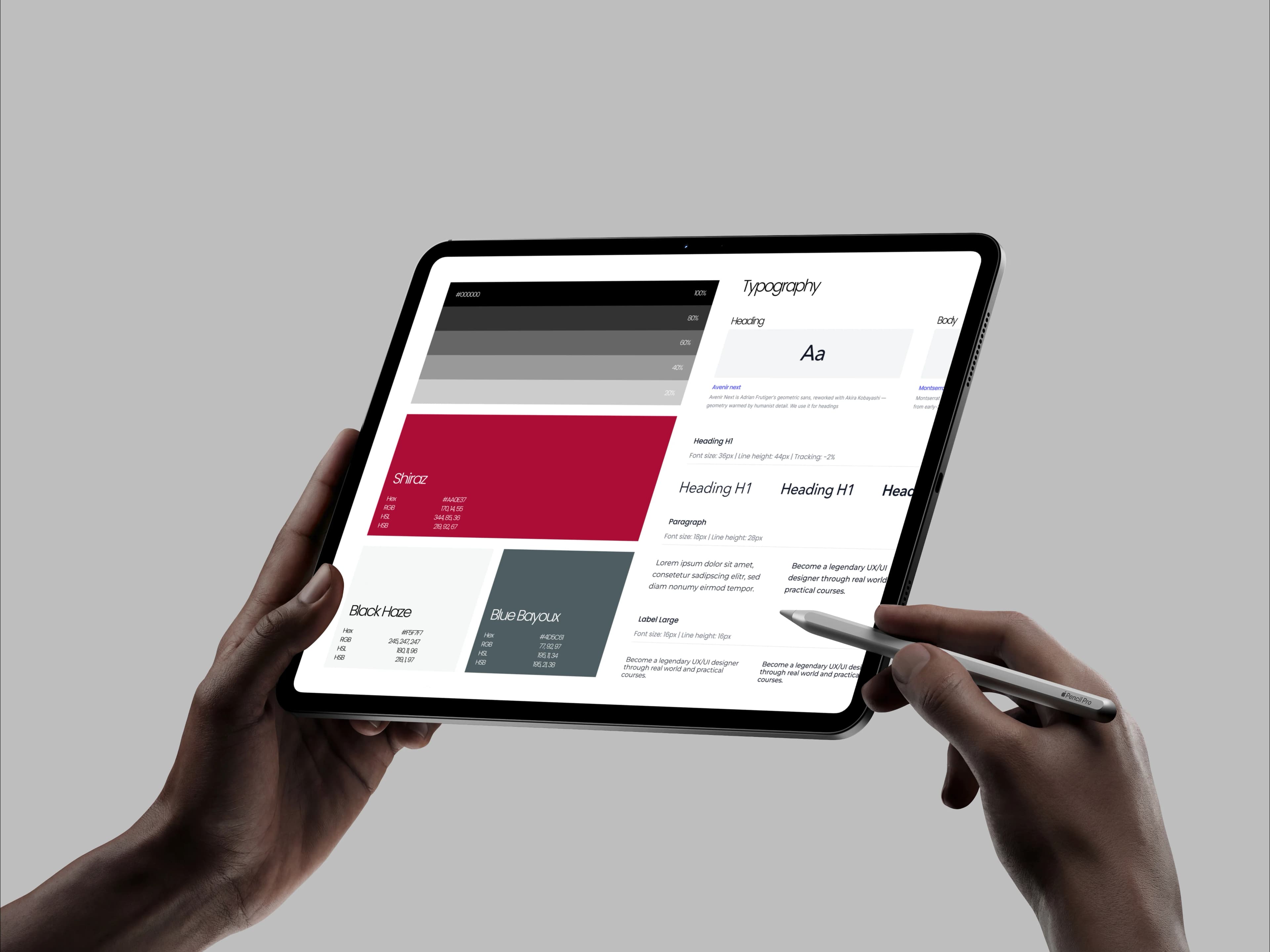 Hands holding a tablet showing a color palette and typography guidelines